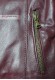 Zipper on the outside pocket of the Clara Doper'S purple shearling hooded leather jacket